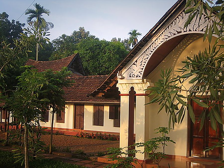 Close-up of the carved wooden gable over the cottage entrance